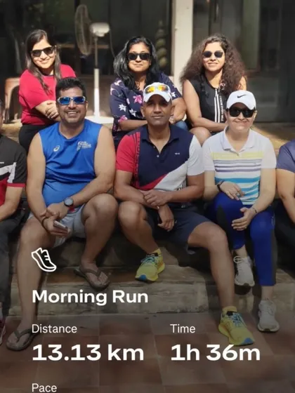 A group photo from a birthday run, with the run stats proudly displayed. We ran 13km to celebrate and earned that cake.
