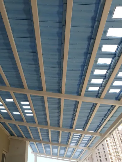 A wider angle of the Santorini-themed pergola, showing its scale and how it covers a large balcony area, creating a substantial and unique outdoor room.