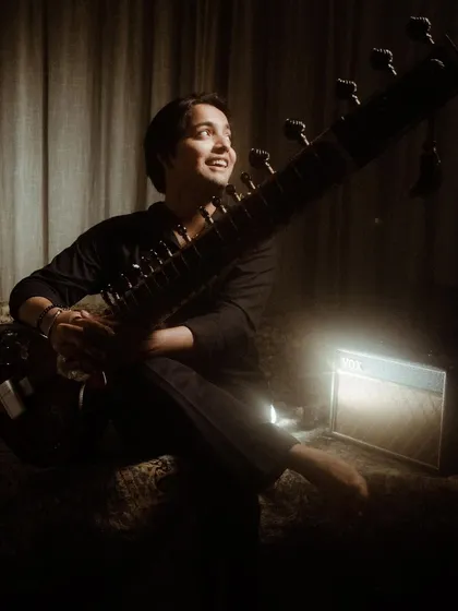 A smile during a photoshoot. Even in posed pictures, I try to let the joy I feel for music shine through.