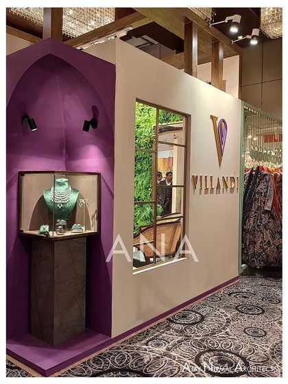 A detail of the carved purple vault and display window on the exterior of the Villandi '22 stall. This element combines branding, architectural interest, and product showcasing in a single feature.
