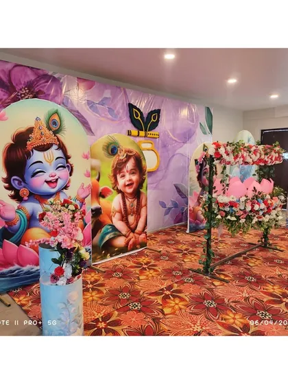 We designed this beautiful Krishna-themed naming ceremony with custom backdrops featuring little Krishna, a floral decorated swing for the baby, and matching plinths. It's a perfect blend of tradition and playful charm.