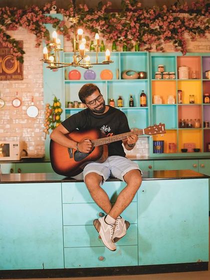 A musical serenade in the kitchen set, a perfect shot for a fun-loving couple.
