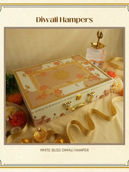 The 'White Bliss' Diwali Hamper. A beautiful floral-printed suitcase box that exudes elegance and charm. It can be customized with an assortment of chocolates and dry fruits.
