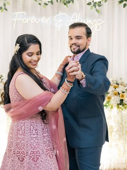 A slow dance during the reception against a beautiful floral backdrop. These are the romantic moments that complete your wedding story.