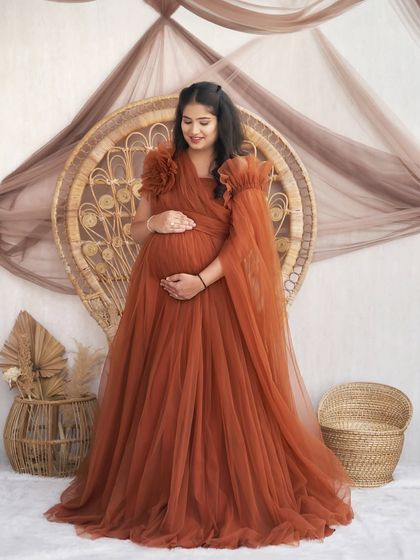 A full-length portrait of our Copper gown. This version features detachable ruffled sleeves for a more dramatic and romantic look.