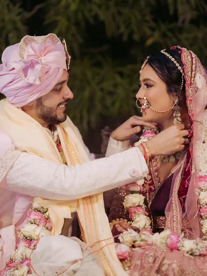 A sweet moment of adjustment and care during the wedding ceremony. It's the small, loving gestures that reveal the depth of a couple's bond.