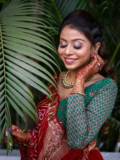 A close-up showing the soft pink and gold eyeshadow, which adds a touch of glamour to the traditional look.