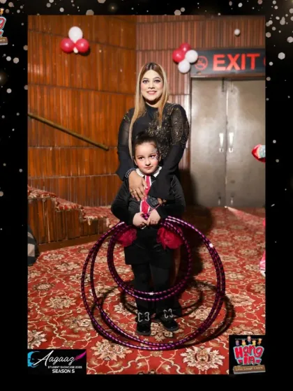 A proud moment between our hula hoop instructor and a young performer backstage at the Aagaaz showcase.