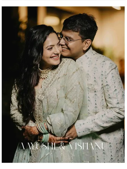 A joyful and candid moment between the newly engaged couple. Their laughter is infectious, and this photo is a perfect memory of their happy celebration.
