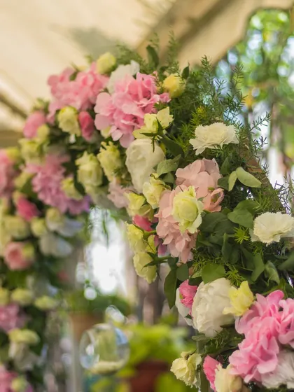 A close-up of a beautiful floral arch, showcasing the quality and freshness of the flowers used in our decor.