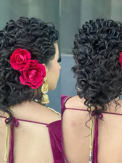 A detailed shot of the curly Marathi-style updo, showing the texture of the curls and the placement of the flowers.