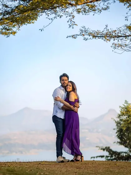 A beautiful pre-wedding shot with a stunning mountain and lake backdrop. This showcases our ability to capture love stories in breathtaking natural landscapes, making the destination a key part of the photo.