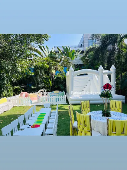 We can create a complete kids' corner for your event. This photo shows how our soft play area, white bouncy castle, and kid-sized tables and chairs come together to make a dedicated, fun, and functional space for your youngest guests.