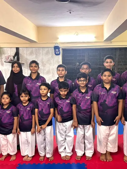 A group photo of our students in their team shirts. We foster a sense of belonging and teamwork in every class.