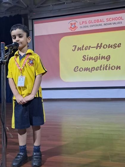 A student from the yellow house delivers his performance at the Inter-House Singing Competition.