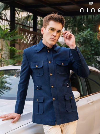 A closer portrait in the safari jacket, highlighting the smart collar and functional pocket details.