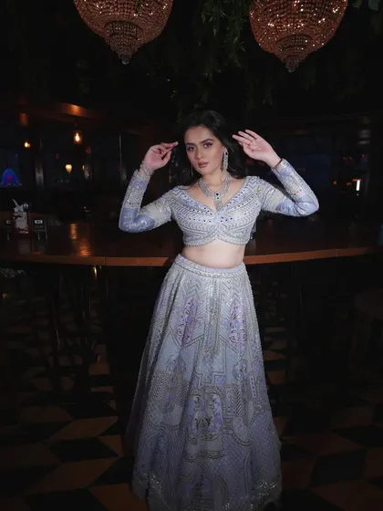 A full-length shot showing how the makeup and outfit come together. The cool tones of the lehenga are balanced by the warmth I added to her skin.
