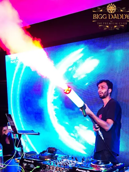Bringing the full concert feel means going all out. Here I am with a CO2 jet, blasting the crowd during a high-energy drop at Bigg Daddy. It's all about creating those unforgettable moments.