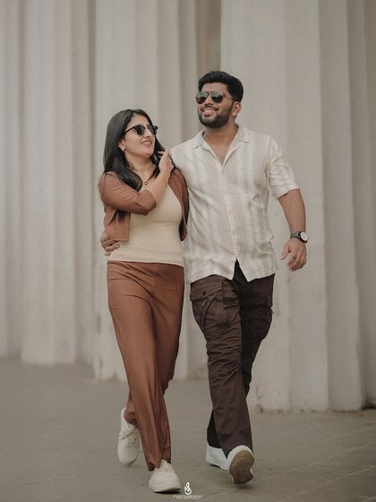 A cool, casual walking shot. The sunglasses and relaxed posture give this a very chic and contemporary feel.