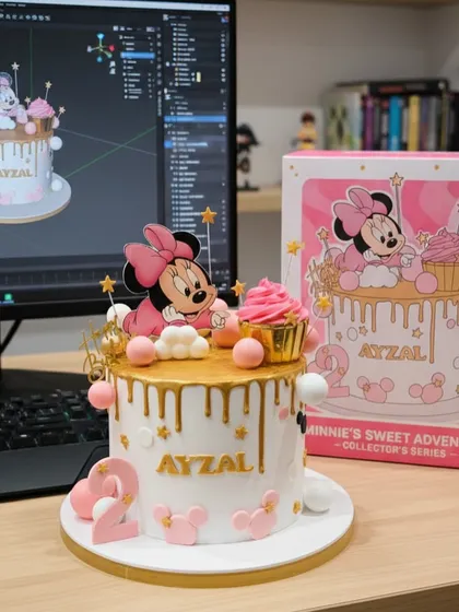I recreated this Minnie Mouse design with precision, matching the cake to the customer's reference image. The cake features a gold drip, pink details, and a cute Minnie topper for a sweet second birthday.