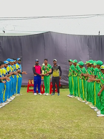 The captain of the runner-up team receiving the trophy.