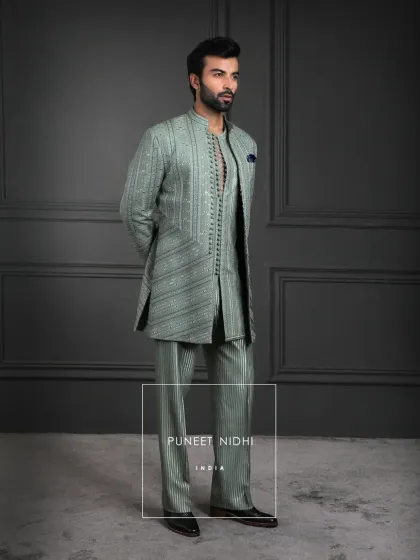 Sage green serenity meets Indian regality. This layered creation embodies understated luxury and timeless charm, transforming Indian elegance for the modern day.