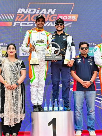 The winners celebrate on the podium at the Indian Racing Festival. We design and manage the presentation ceremonies, ensuring a professional conclusion to the race weekend.