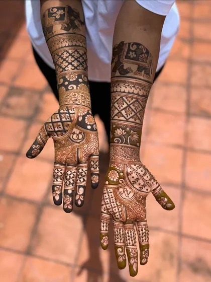 A stunning engagement mehendi with elephant motifs and intricate grid work, offering a rich and detailed look.