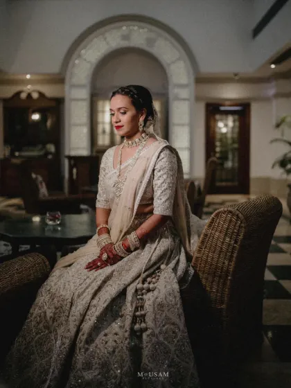 Before the ceremonies begin, there's a moment of quiet reflection. I always suggest we find a calm corner to create these timeless, editorial bridal portraits. Here, under soft lights, the world slows down. It’s a chance to capture the bride's serene beauty and the quiet anticipation of the journey ahead, creating a frame that feels like a love letter to this moment in time.