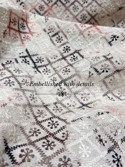 A unique geometric embroidery with a folksy charm, this fabric is perfect for a standout Nehru jacket or bandhgala.