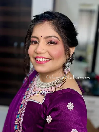 Her smile shows how happy she is with the final look. I love creating makeup that boosts my clients' confidence.