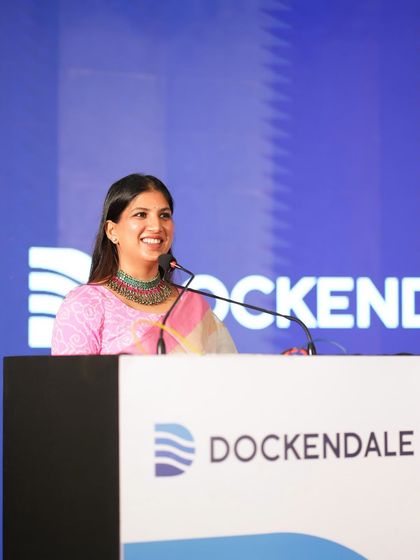 A close-up shot from the Dockendale conference, showing my professional and engaging presence at the lectern.