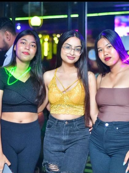 A stylish trio posing for the camera at Drava's Ladies Night.