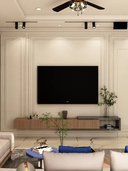 This angle shows the floating TV console and track lighting, key elements in our modern living room designs that ensure a clean, uncluttered look while providing focused illumination.