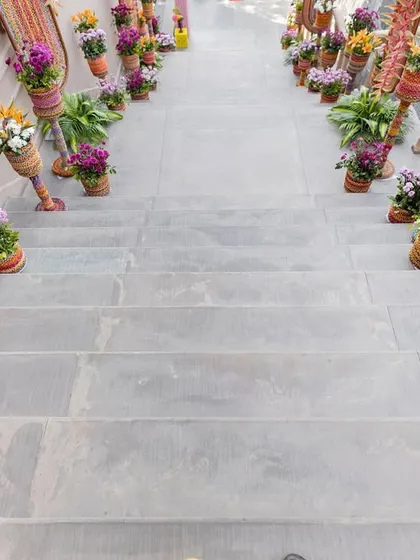 The staircase leading to the event, lined with colorful potted flowers, creating a beautiful and fragrant pathway for guests.