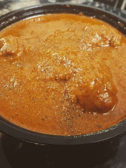 The thick, rich gravy of our butter chicken coats every piece of tender chicken.