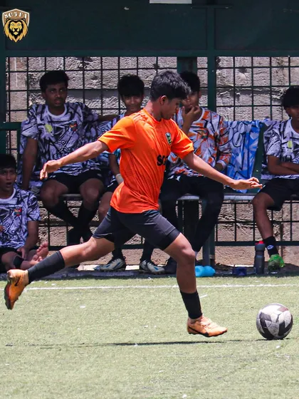 A player lining up a powerful shot or cross, demonstrating excellent technique.