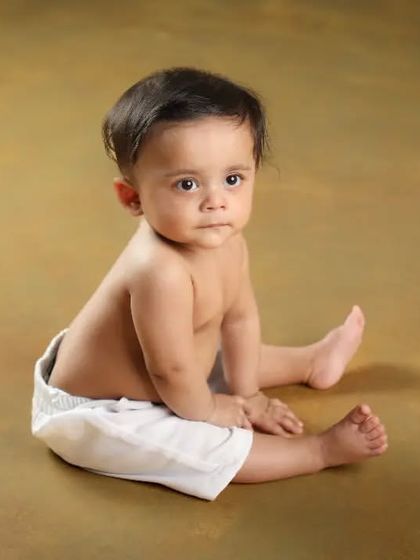 A simple and classic portrait of a beautiful baby boy. Sometimes all you need is a clean background to let their sweet face shine.
