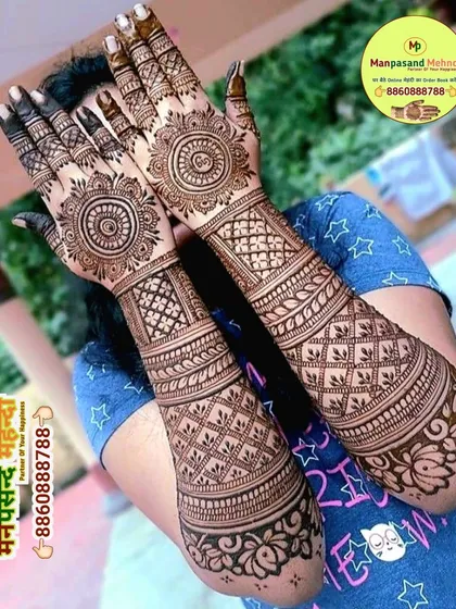 A classic mandala design on the back of the hands. The symmetrical patterns and detailed line work create a beautiful and timeless look.