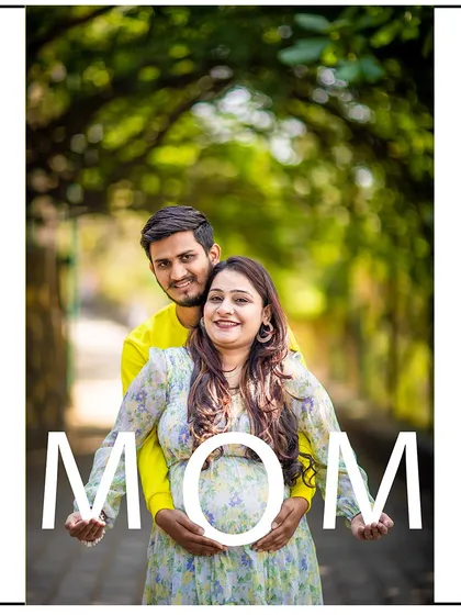 A sweet embrace from behind, with the couple holding letters that spell "MOM".