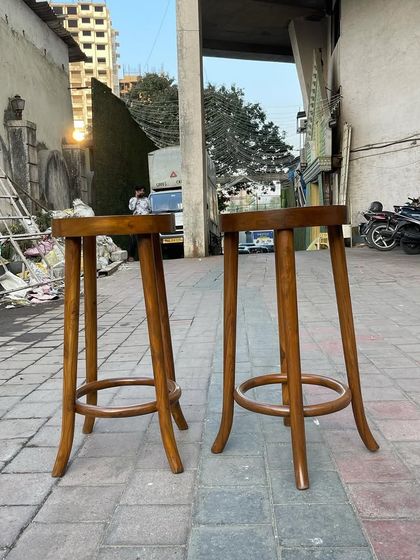 The simple yet sturdy design of these teak bar stools ensures they will last for years, even in a busy commercial environment.