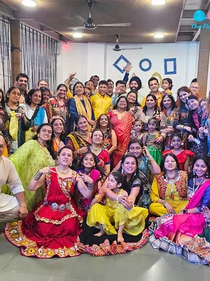 A vibrant Garba night celebration with a large group dressed in colorful traditional attire. Our spacious banquet hall is perfect for hosting large festive gatherings.