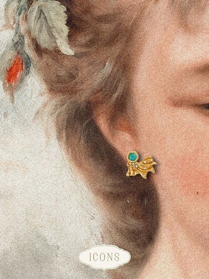 The Opaline Miniature Studs are a stunning rendition of the Odeta Floral Studs. The carved metal base with a pop of aquamarine makes them a unique and artistic choice for stud earrings.