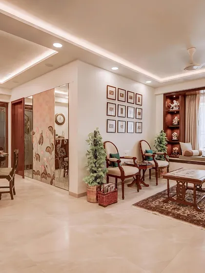 This wider angle shows the seamless flow from the living area to the dining space, which is subtly divided by a custom-printed glass partition. The design creates an open yet defined layout.