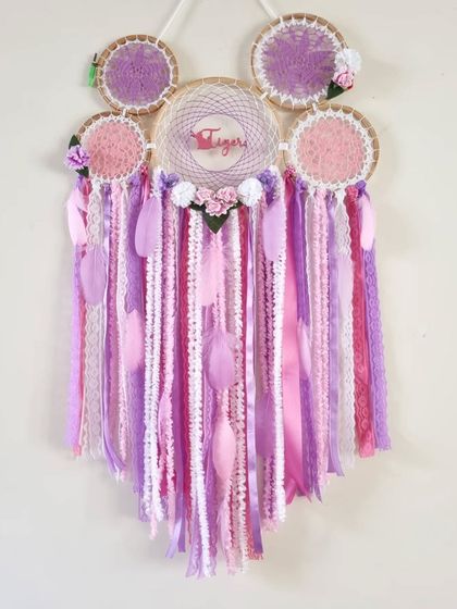 A close-up of the custom dreamcatcher we made for a client's cat, 'Tiger'. The pink and purple theme makes it a sweet and playful addition to any pet lover's home.