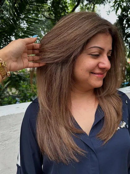 A classic 'Ash Blonde'. This is a great option for those who want to go lighter but prefer cooler tones over warm, golden shades. It's sophisticated and chic.