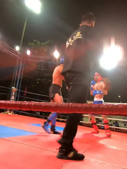 In the heat of competition, our fighter stays focused on his opponent in the ring.
