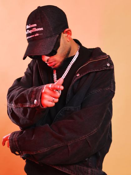 A studio shot with a direct, engaging pose. This image communicates the confidence and ambition that I bring to my music and performances.