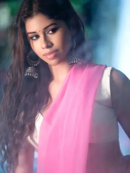 An atmospheric close-up with a soft, misty effect. This artistic approach creates a dreamy and romantic mood, perfect for beauty-focused ethnic portraits.