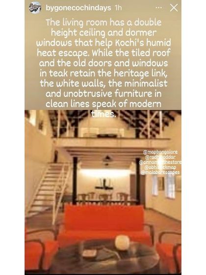 This image highlights the living room's double-height ceiling and dormer windows, original features we preserved to help with natural ventilation. The design retains the heritage link through teak doors and windows while using minimalist furniture for a modern feel.